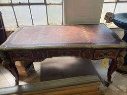 1960s French Louis XV Style Ornate Carved Wood Desk With Figural Accents and Leather Inlaid Top