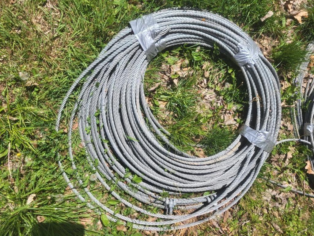 300+ ft of 3/8" zip line cable with anchor cables. Includes 5 Petzl cable trolleys with 4 carabiner