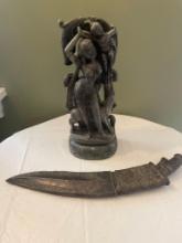 Marble statue, knife with sheath