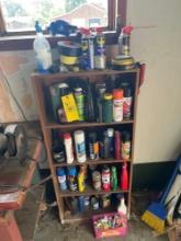 Wooden shelf with cleaners and lubricants