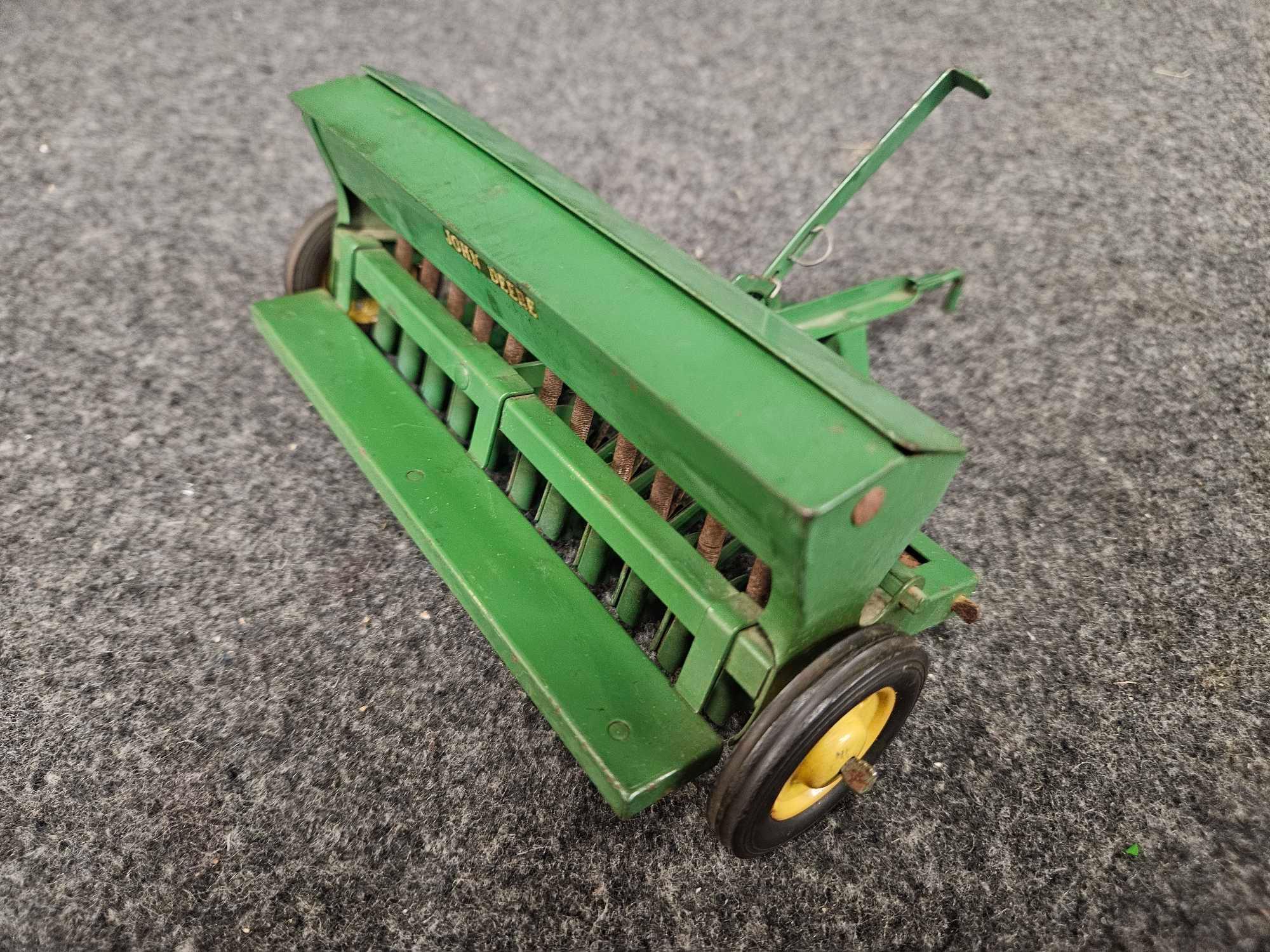 Assortment of Vintage John Deere Implements - Plow, Spreader, Drill 1/16