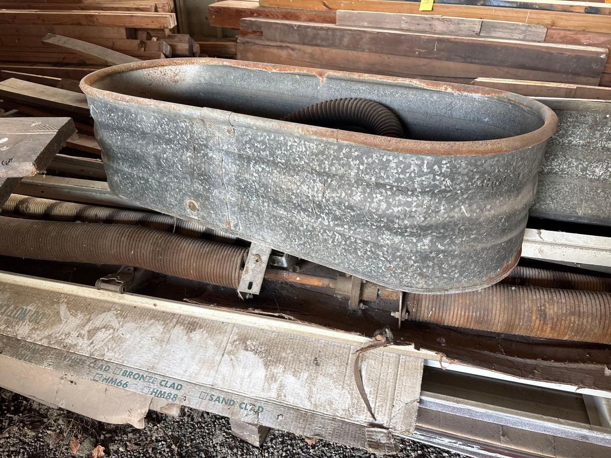 Two galvanized water troughs
