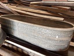 Two galvanized water troughs
