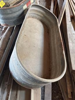 Two galvanized water troughs