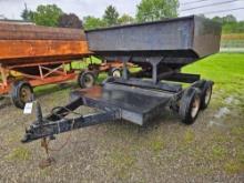 Gravity box on tandem trailer