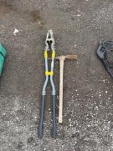 post hole digger and a pick axe