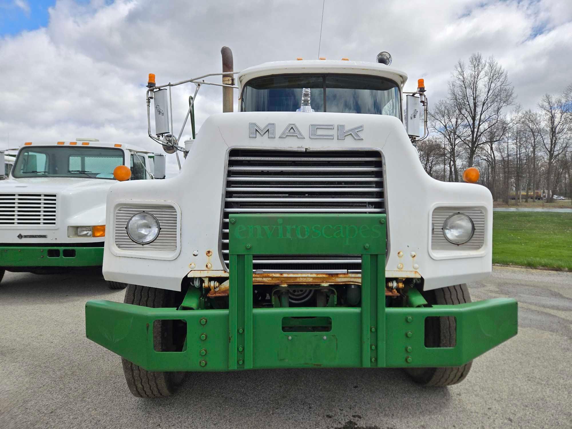 1995 Mack DM690S Roll Back Truck, runs and drives, 20 ft deck with winch