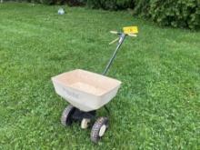 Walk behind fertilizer spreader