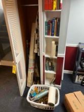 Books, recurve bow, Stanley thermos, glassware