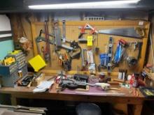 Contents of the basement work bench - Saws, crowbars, hardware