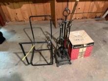 Fireplace tools, firewood storage, and a chimney brush