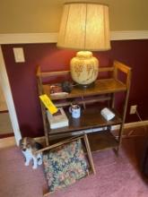 Wooden chest with a table lamp and dog statue