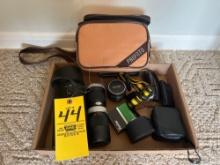 Vivitar camera lenses with a camera bag and accessories