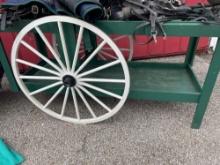 two tear green cart on wheels.