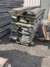 Stack of miscellaneous hickory wood and large boards