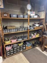 assorted hardware and power tools in basement shelf
