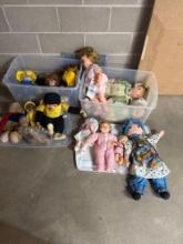 two boxes of dolls and bears