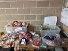 table top of assorted dolls and toy China sets