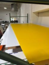 large sheets of corrugated plastic and smaller pieces of foam board
