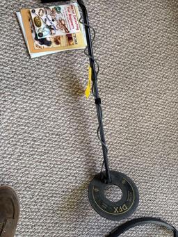 metal detector with books and misc supplies