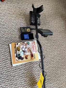 metal detector with books and misc supplies