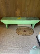 Painted wooden bench and small rug