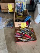 Assorted screw drivers and hand tools.