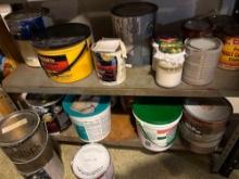metal shelf and wood shelf with contents, mostly paint