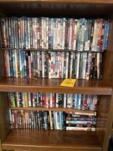 4 shelves of dvd movies