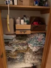 top 5 shelves of closet contents, linens , first aid supplies, misc