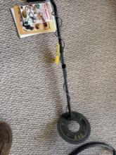 metal detector with books and misc supplies