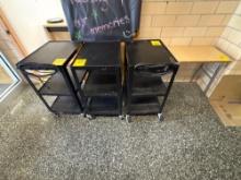 Projector carts, 2 tables, wall clock - outside principal office