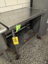 Stainless steel top prep table on casters, cafeteria