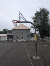 Outdoor basketball hoop cemented in ground