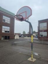 Outdoor basketball hoop cemented in ground
