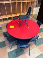 Small round youth table with 7 plastic chairs - 1104