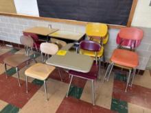 assorted school desks and stacked school chairs - Rm 1121