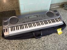 Casio 232 Tone Keyboard with bag - outside gymnasium