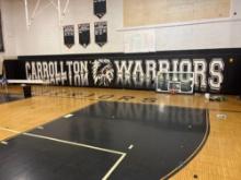 Carrollton Warriors wall pads on South side of gym