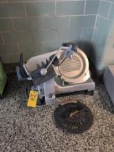 Hobart HS7 electric meat slicer with attachment, outside gymnasium