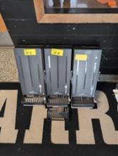 3 plastic utensil dispensers, outside gymnasium