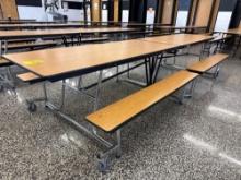 Folding cafeteria lunch table on casters