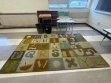 ABC Rug approx 5x8, student desks, organizers, trash cans, mounted tv - Rm 1305