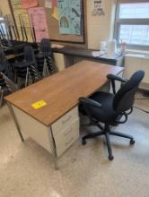 Metal teachers desk with chair, room 2307
