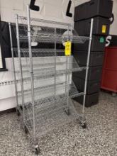 Pair of metal wire bread racks on wheels cafeteria