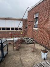 Metal stairs on rolling casters - outside maintenance gargae