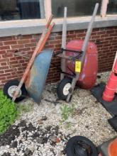 2 wheelbarrows - outside maintenance garage