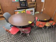 Pair of round activity tables with assorted chairs , room 1401