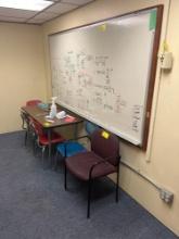 Table, Chairs, white dry erase board - 1405