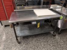 Stainless steel prep table with cutting board, cafeteria